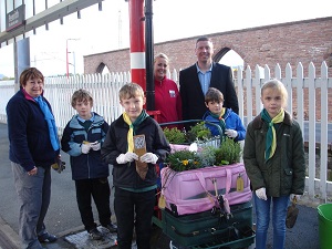 Cubs planting the Penrith Railway Station herbs