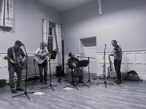 4 piece folk band playing folk music.